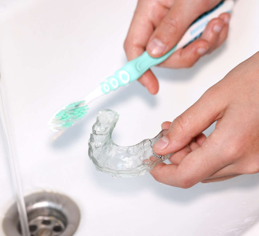 A clear retainer holding a finished result in place